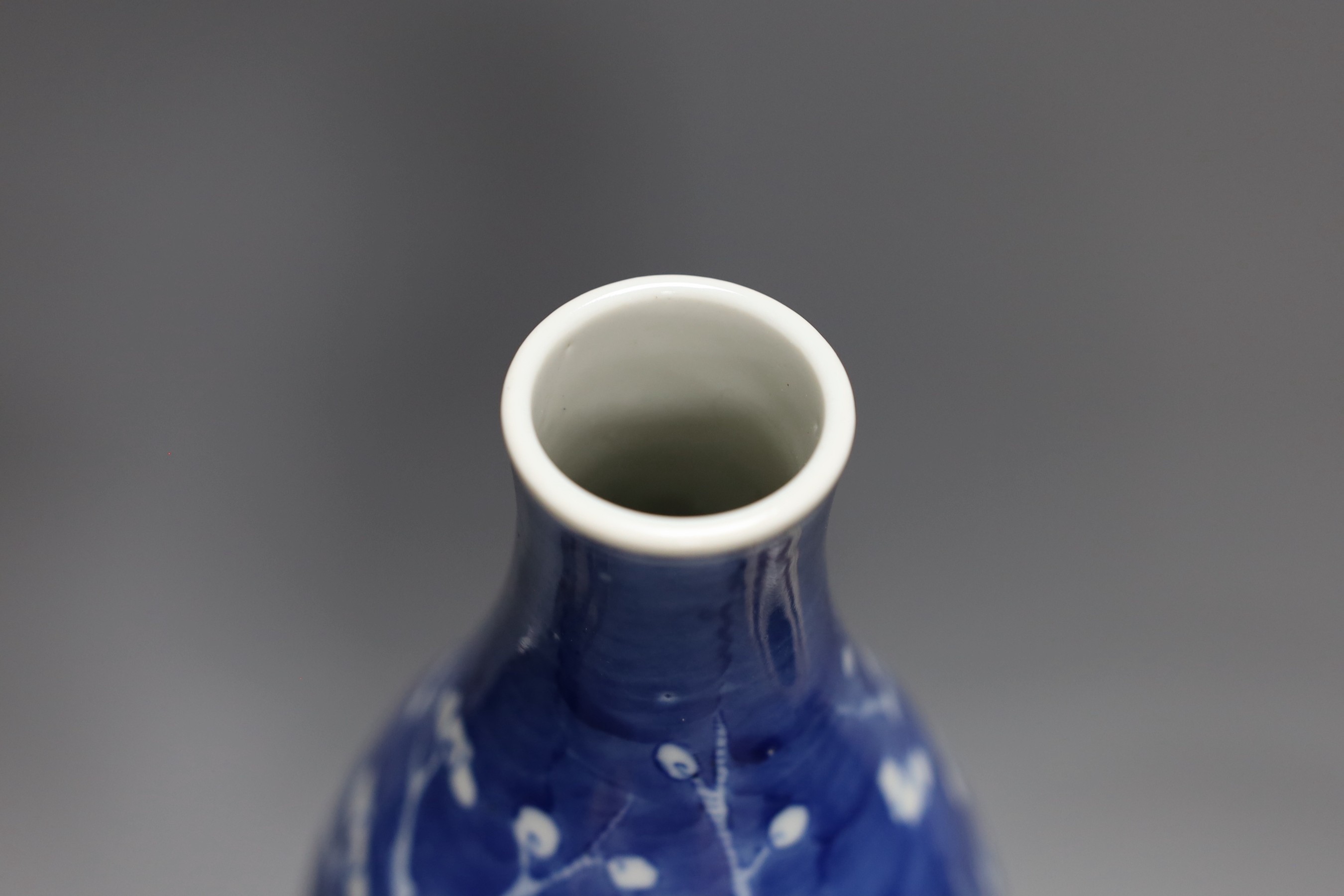 A Chinese crackle glaze vase and jar and a blue with figural decoration, together with a Chinese blue and white prunus double gourd vase, tallest 37cm